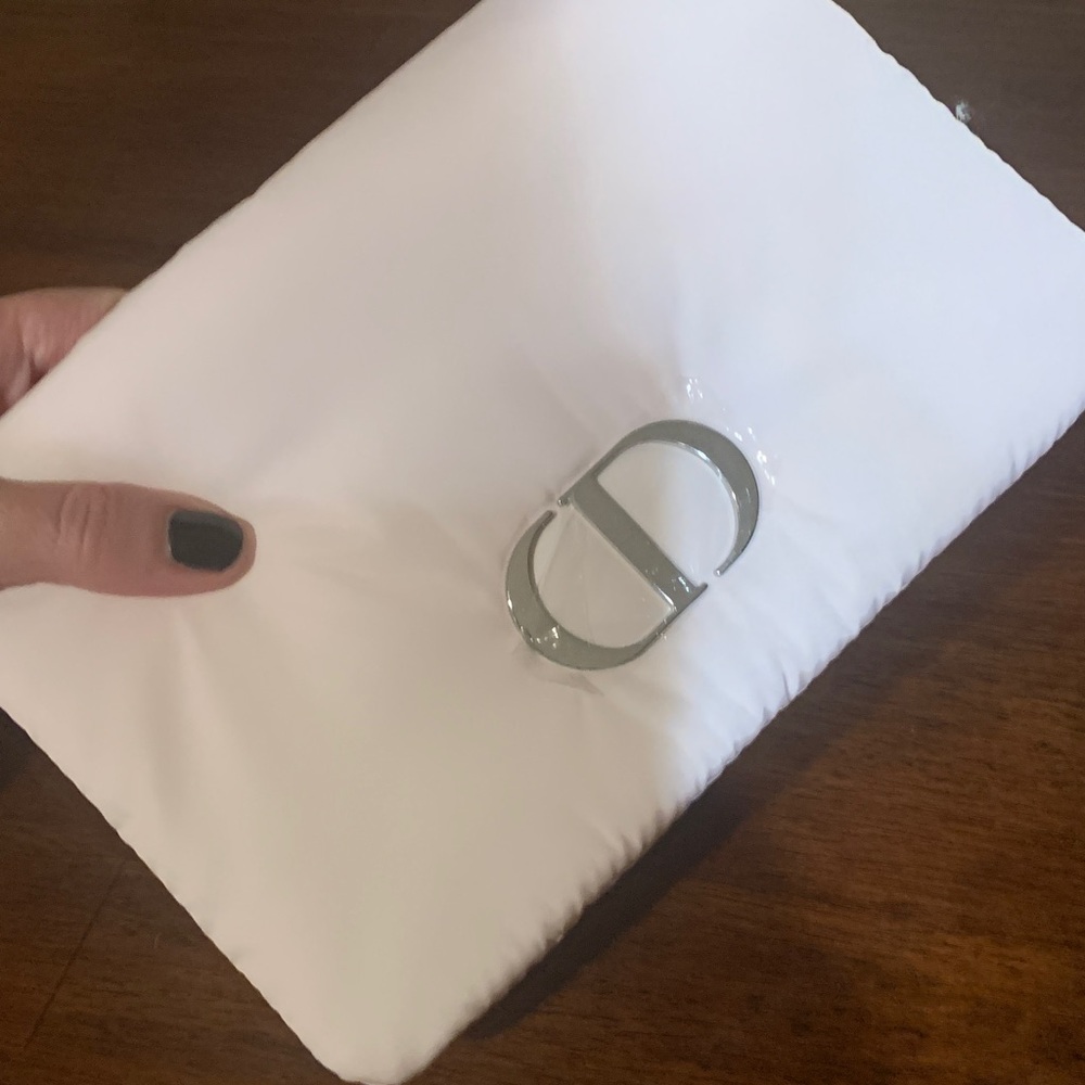 Authentic brand new puffy Christian Dior pink pouch/Clutch with Silver Accent.
